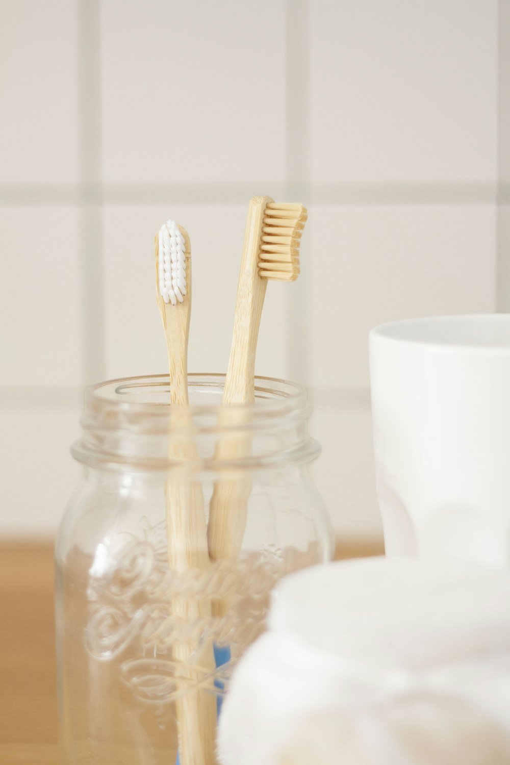 two brown wooden toothbrushes