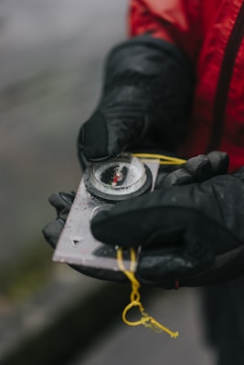 person holding rectangular grey tool