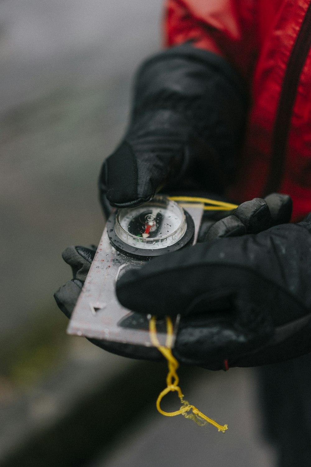 person holding rectangular grey tool