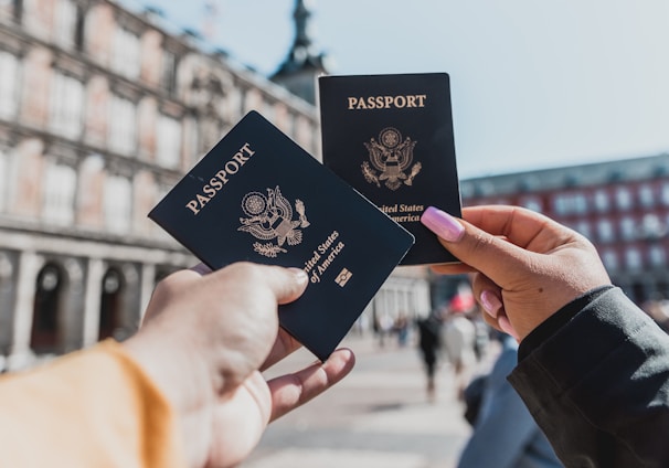 person holding passports