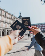 person holding passports