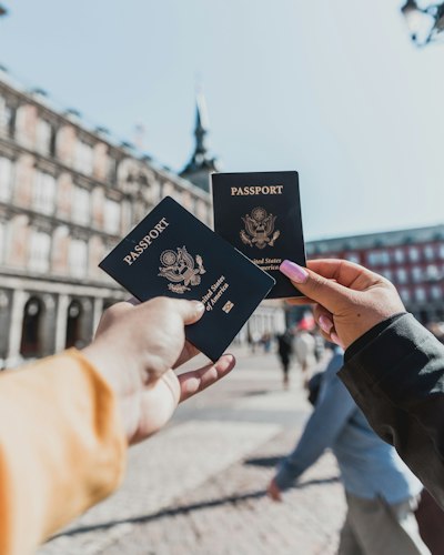 Close-up of a passport page with several travel visa stamps