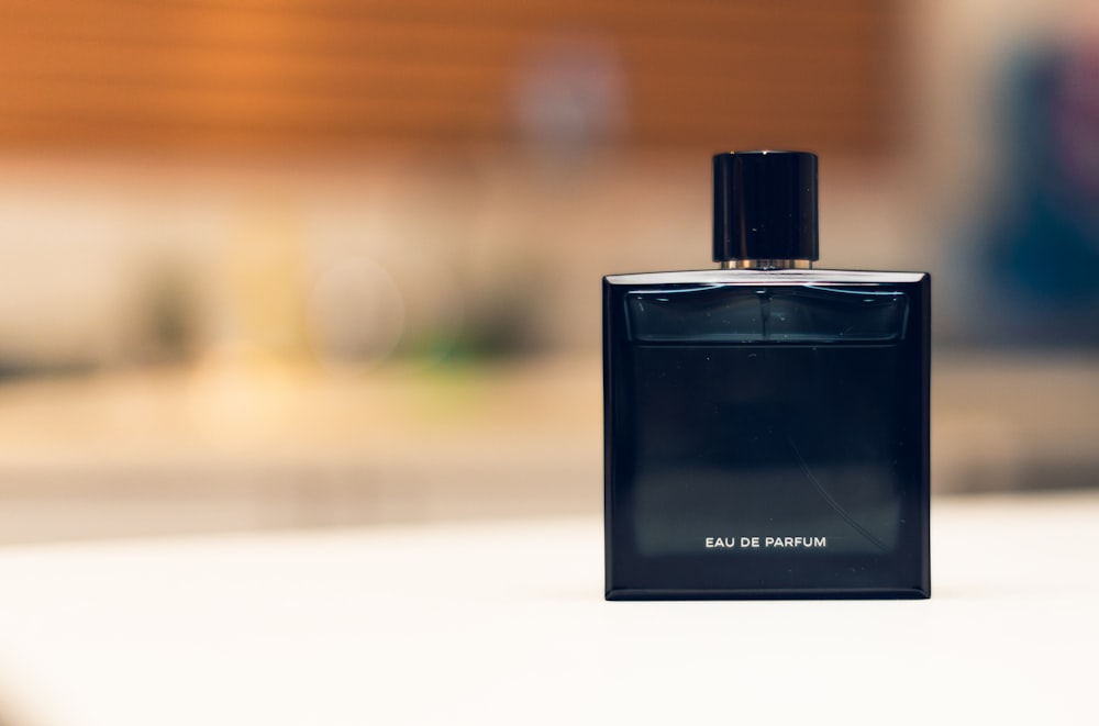 selective focus photography of eau de parfum bottle