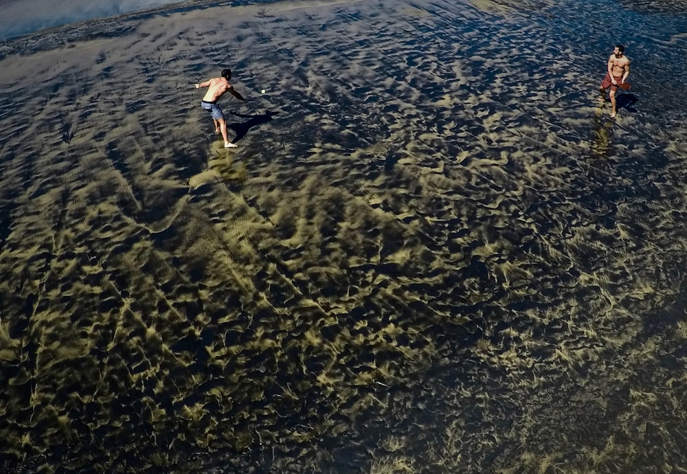 two person on body of water