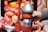 A hand-operated juicer is squeezing a pomegranate half, surrounded by other halved and whole pomegranates. The juicer is metallic with a red fixture, and the environment resembles a fruit market or street vendor setting. The scene includes vivid red and orange hues.