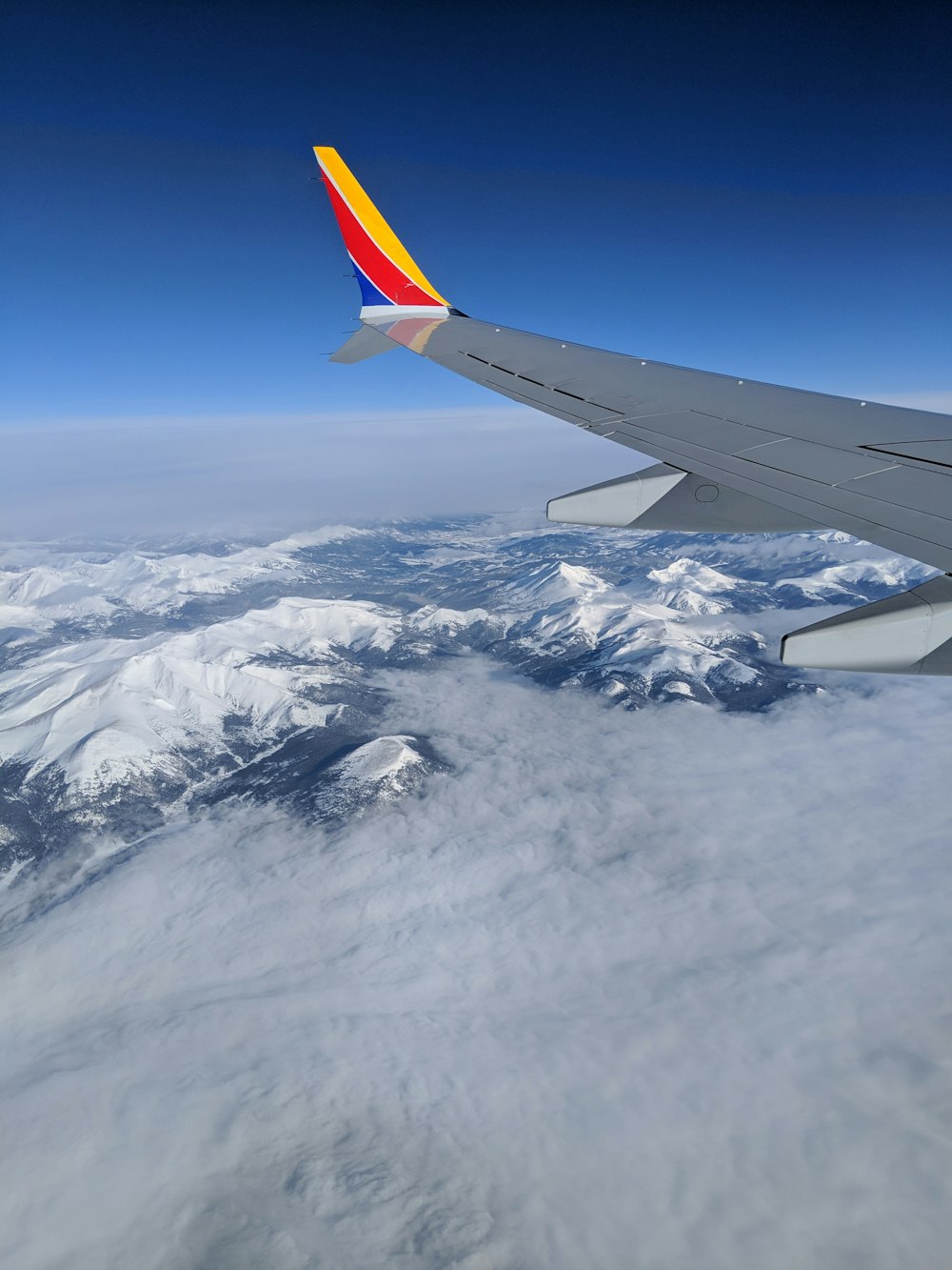 airplane window view of glacier mountains