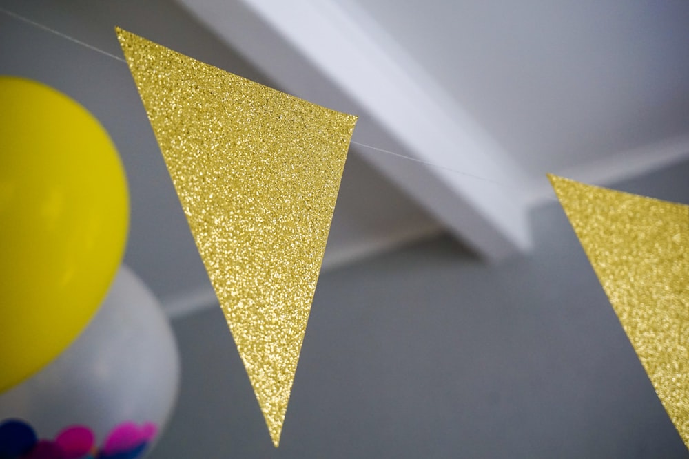yellow glitter buntings hanging inside room