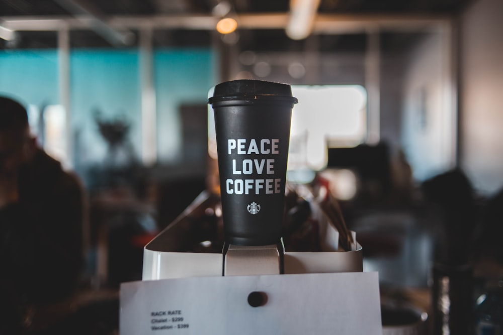 black and white peace love coffee Starbucks disposable cup