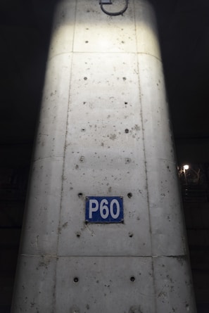 Before and after shots of a reinforced concrete column with repaired surface.