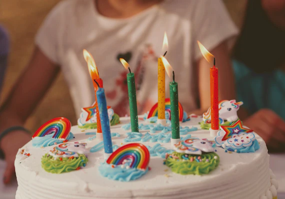 unicorn rainbow Birthday cake with five assorted-color candles