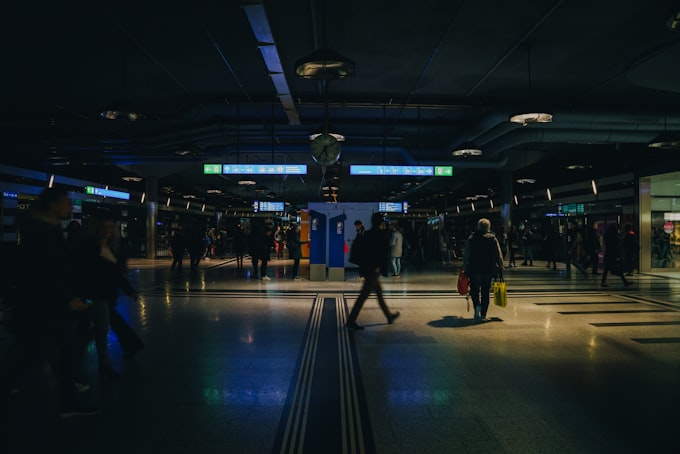 People navigating a public space during a power outage