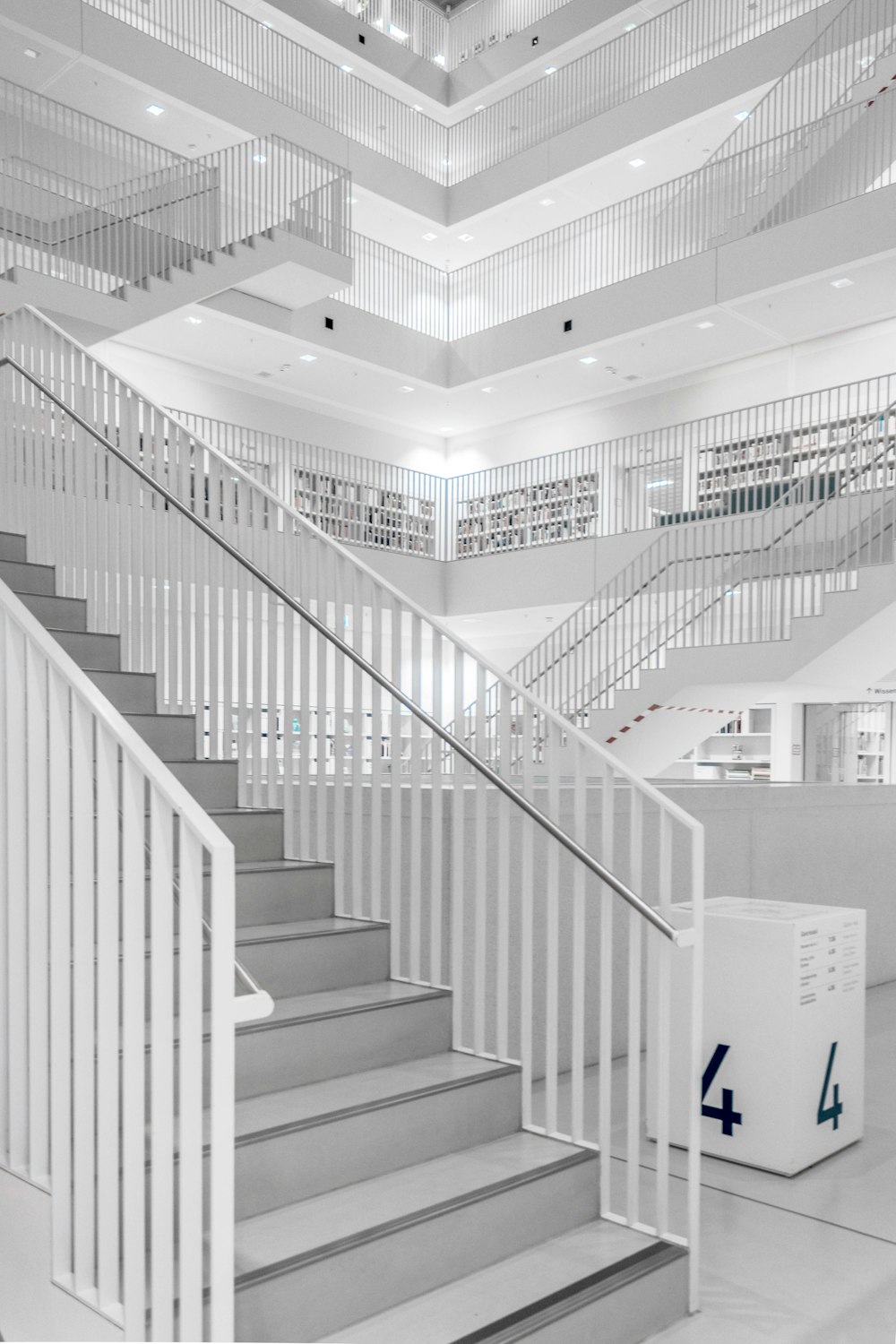 white and grey building staircase