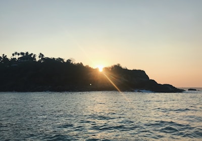 Sunset view from a quiet land plot close to the ocean.