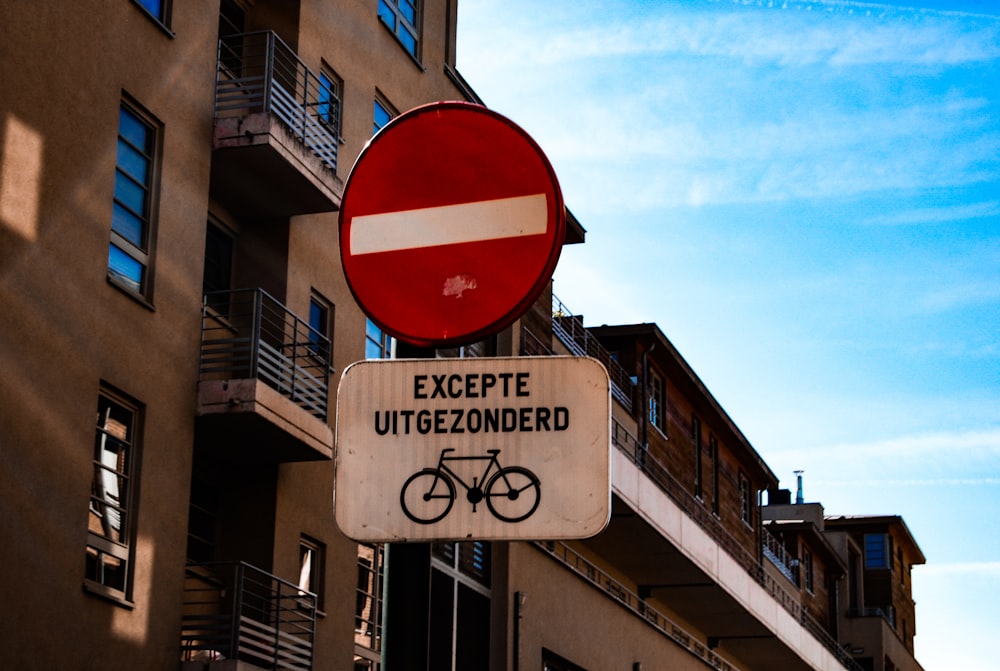 white and black Excepte Uitgezonderd signage during daytime