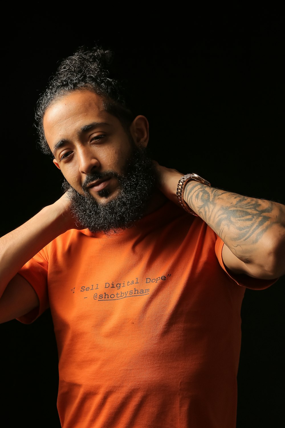 man in orange short-sleeved shirt