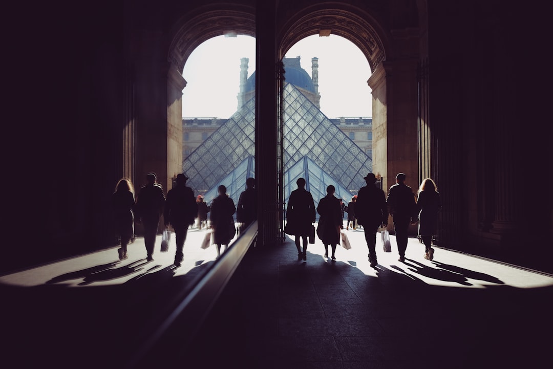 group of people standing inside brown building