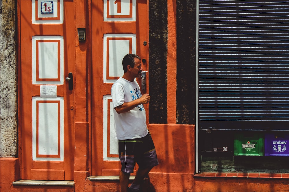 man walking beside building during daytime