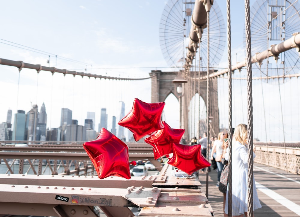 four red star balloons