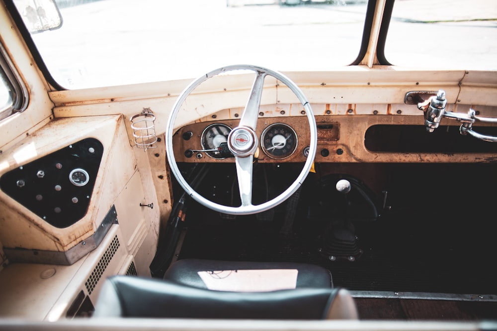 brown classic truck dashboard with white steering wheel