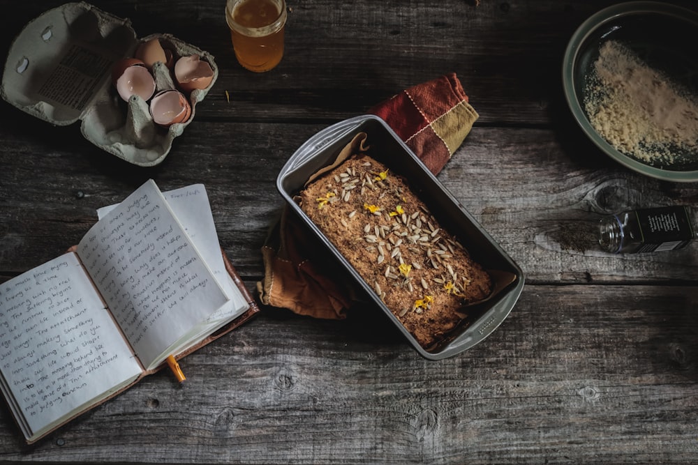 black plastic tray beside book