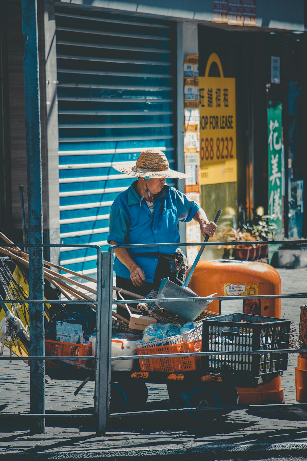 man standing near trash bin