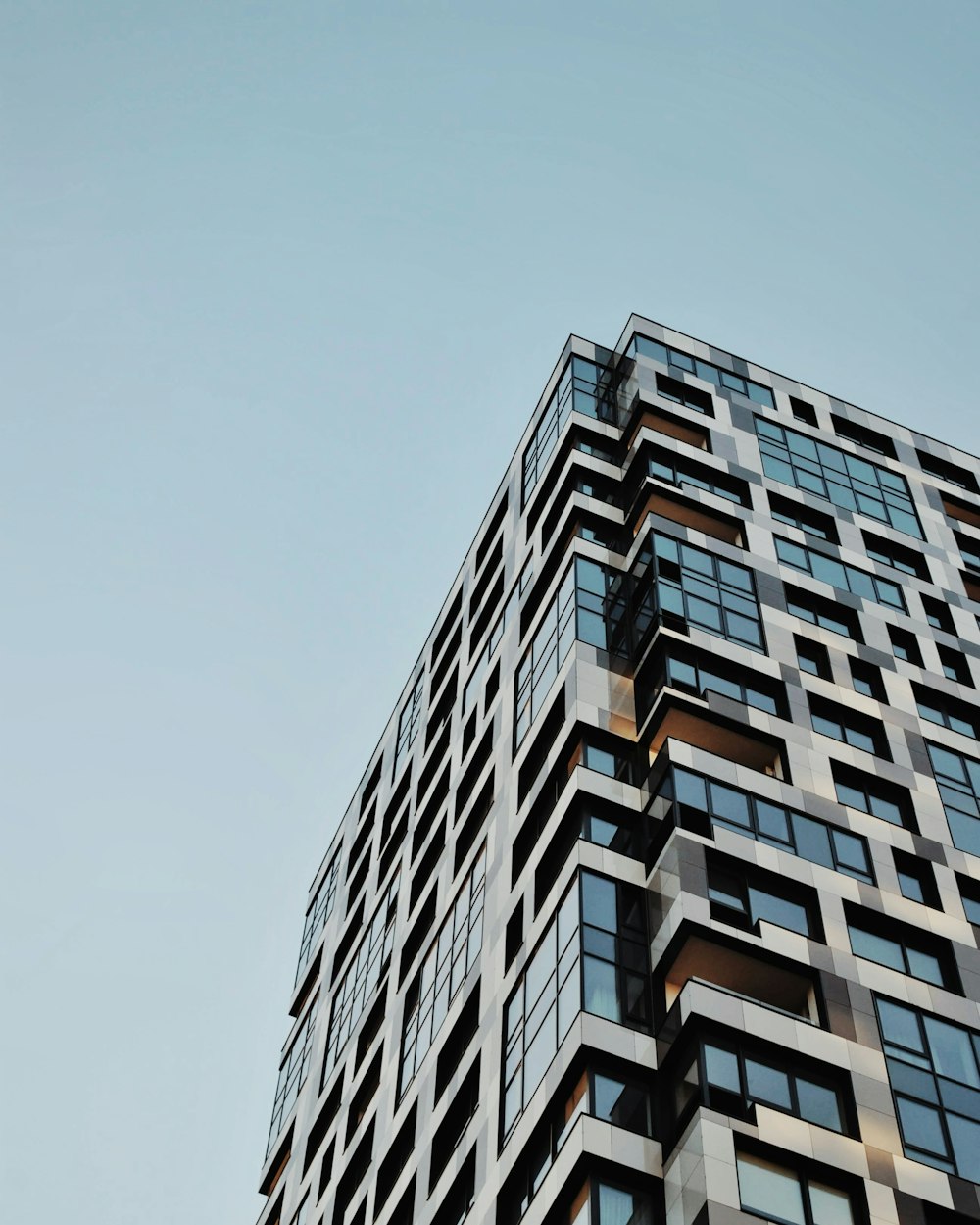 blue and clear glass high-rise building