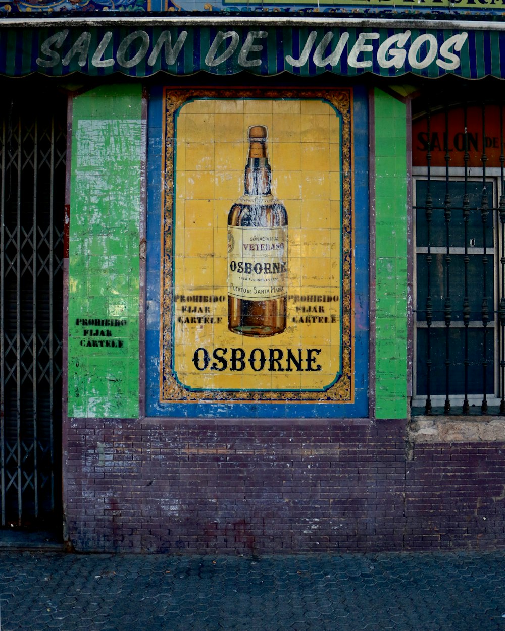 Osborne bottle painting on house wall