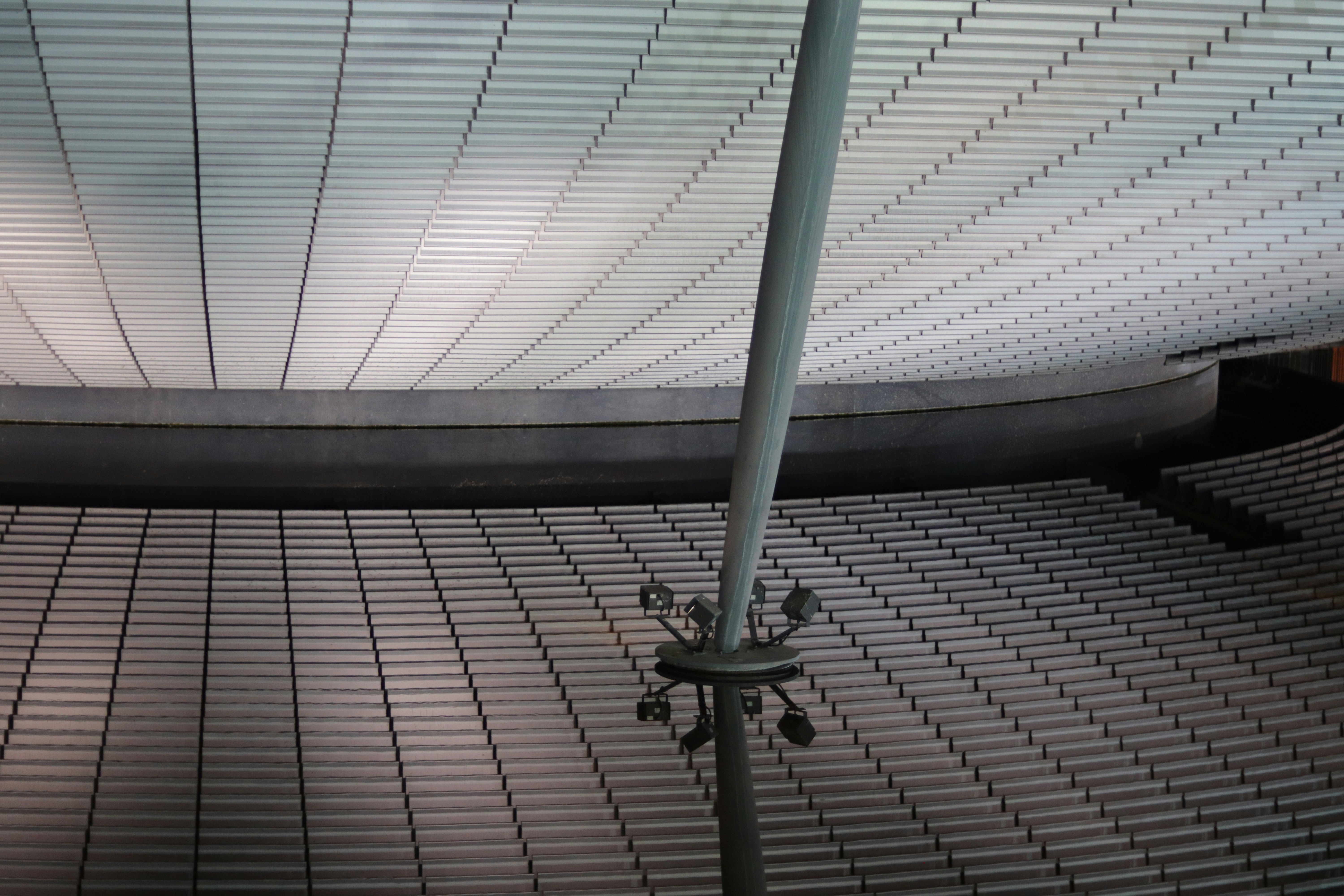 Modern sports stadium with lighting and seating