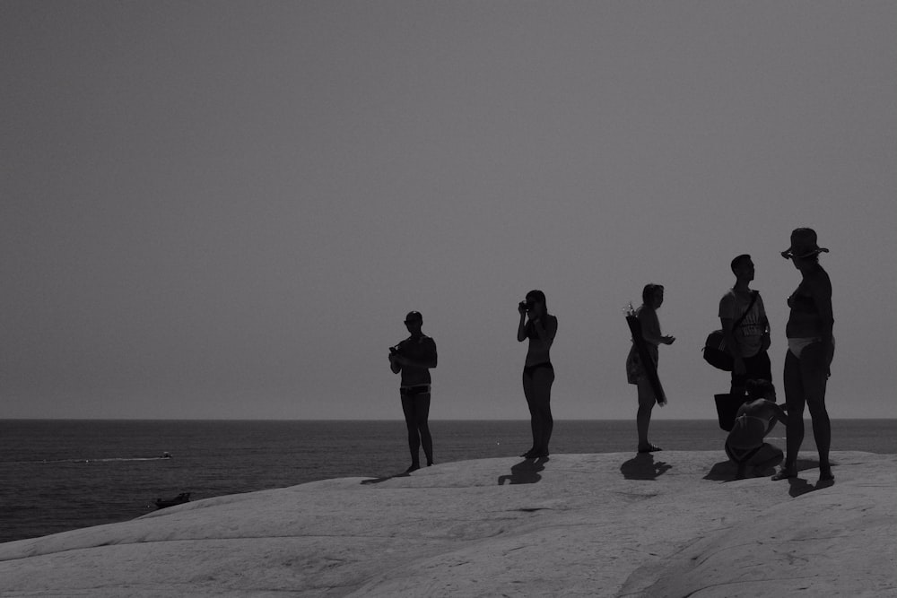 people standing on beach