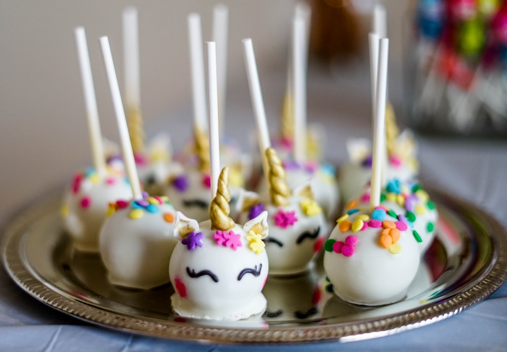 shallow focus photo of unicorn lollipops