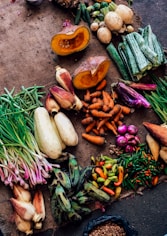 assorted vegetables on brown textile