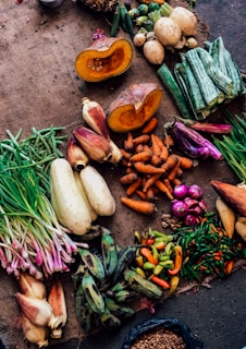 assorted vegetables on brown textile