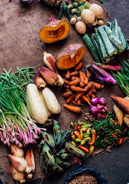 assorted vegetables on brown textile