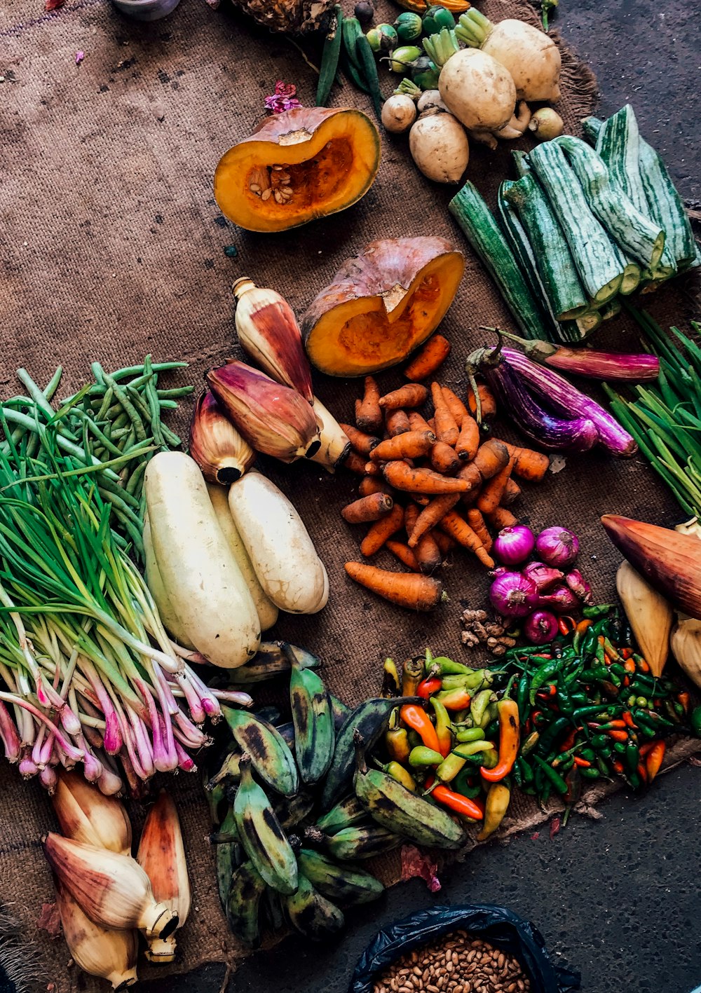 assorted vegetables on brown textile