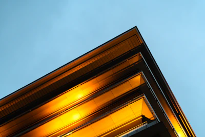 Modern architectural blueprint with orange and black design elements.