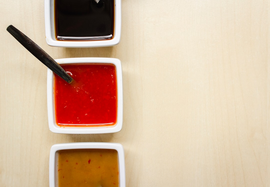 red liquid dip in square bowl