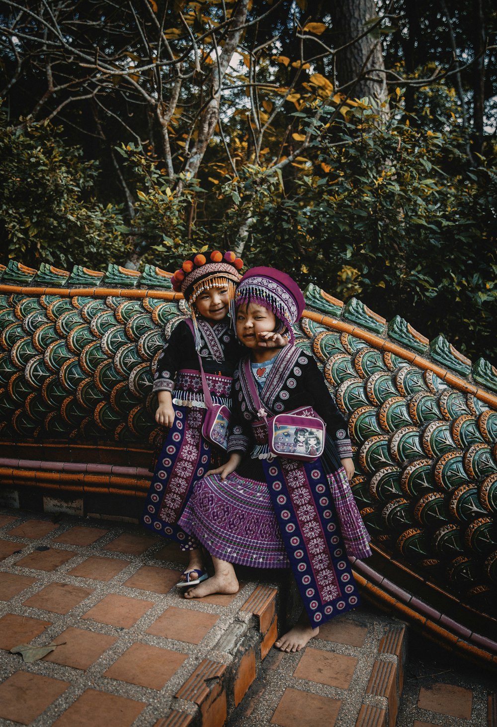 two girls wearing traditional costumes