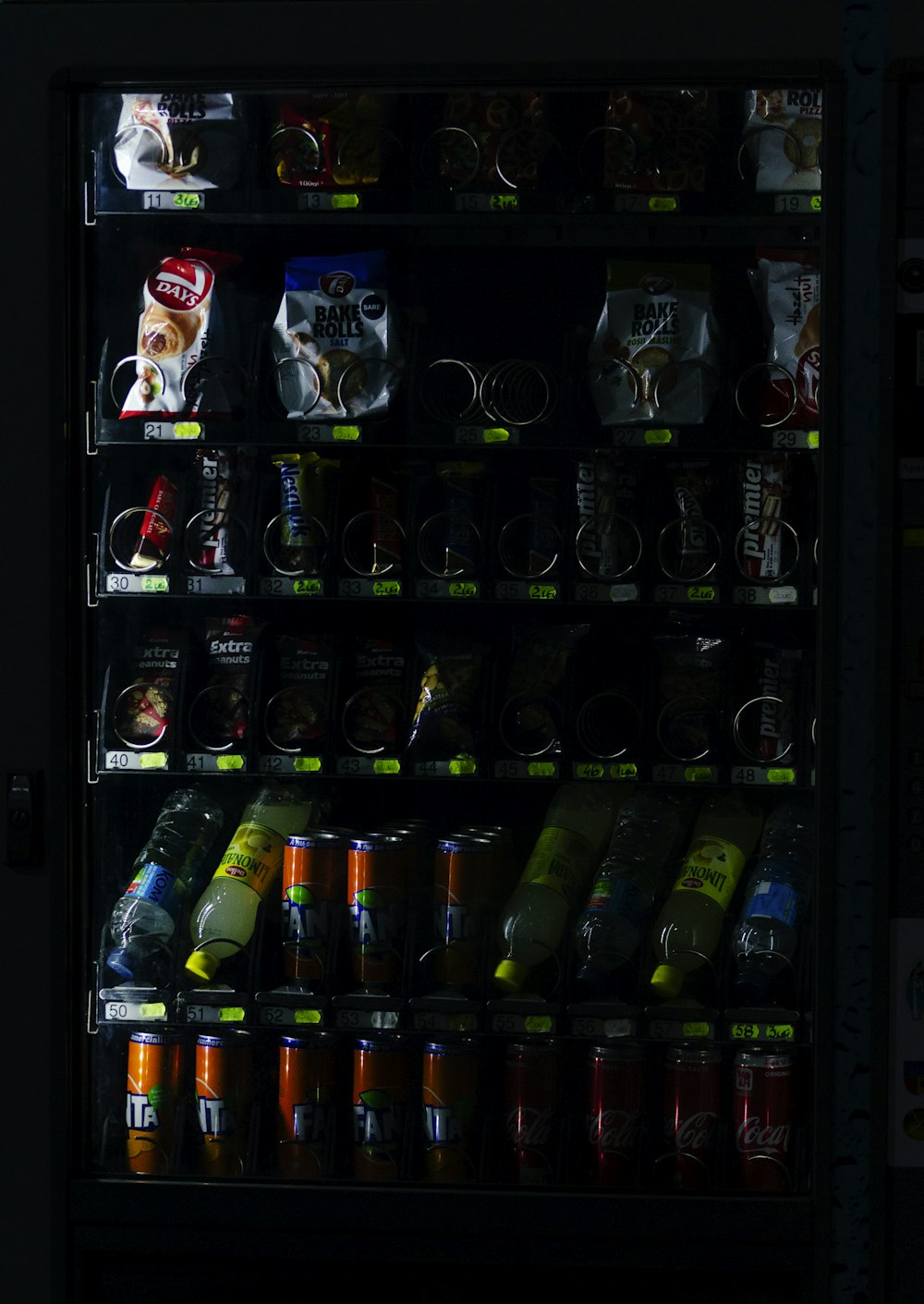 sodas and food pack in vending machine