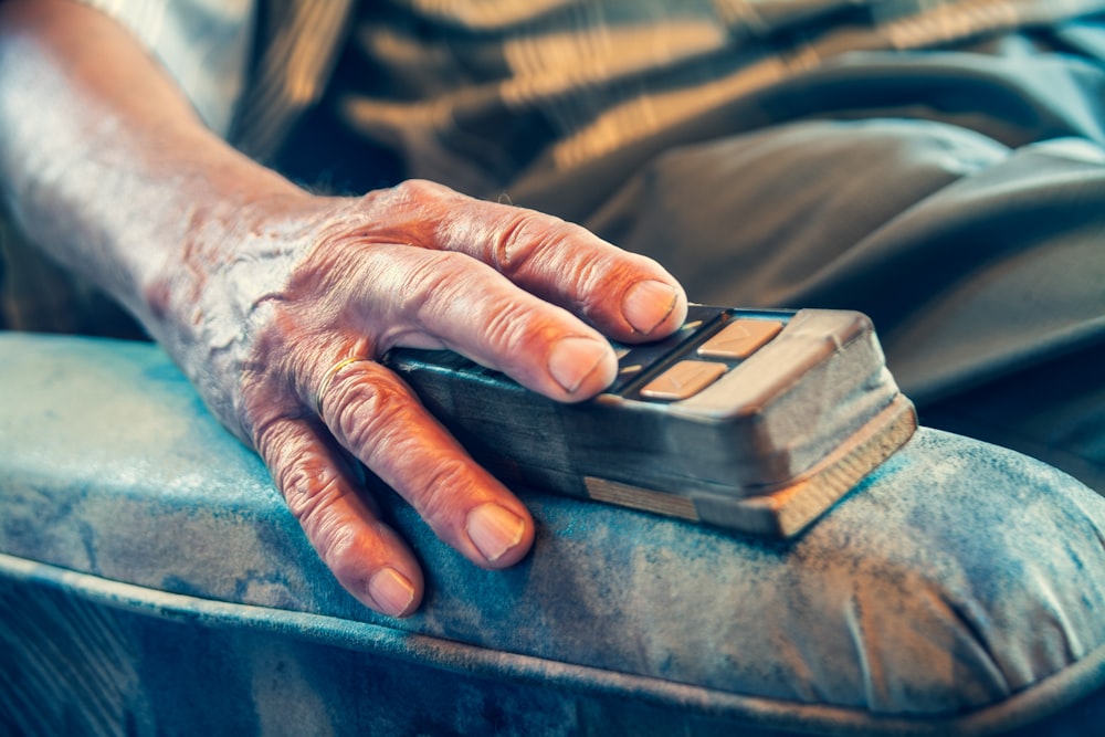 person sitting on sofa chair