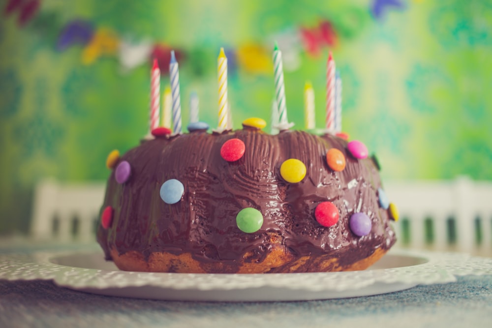 chocolate cake with nips and candles in close-up photography