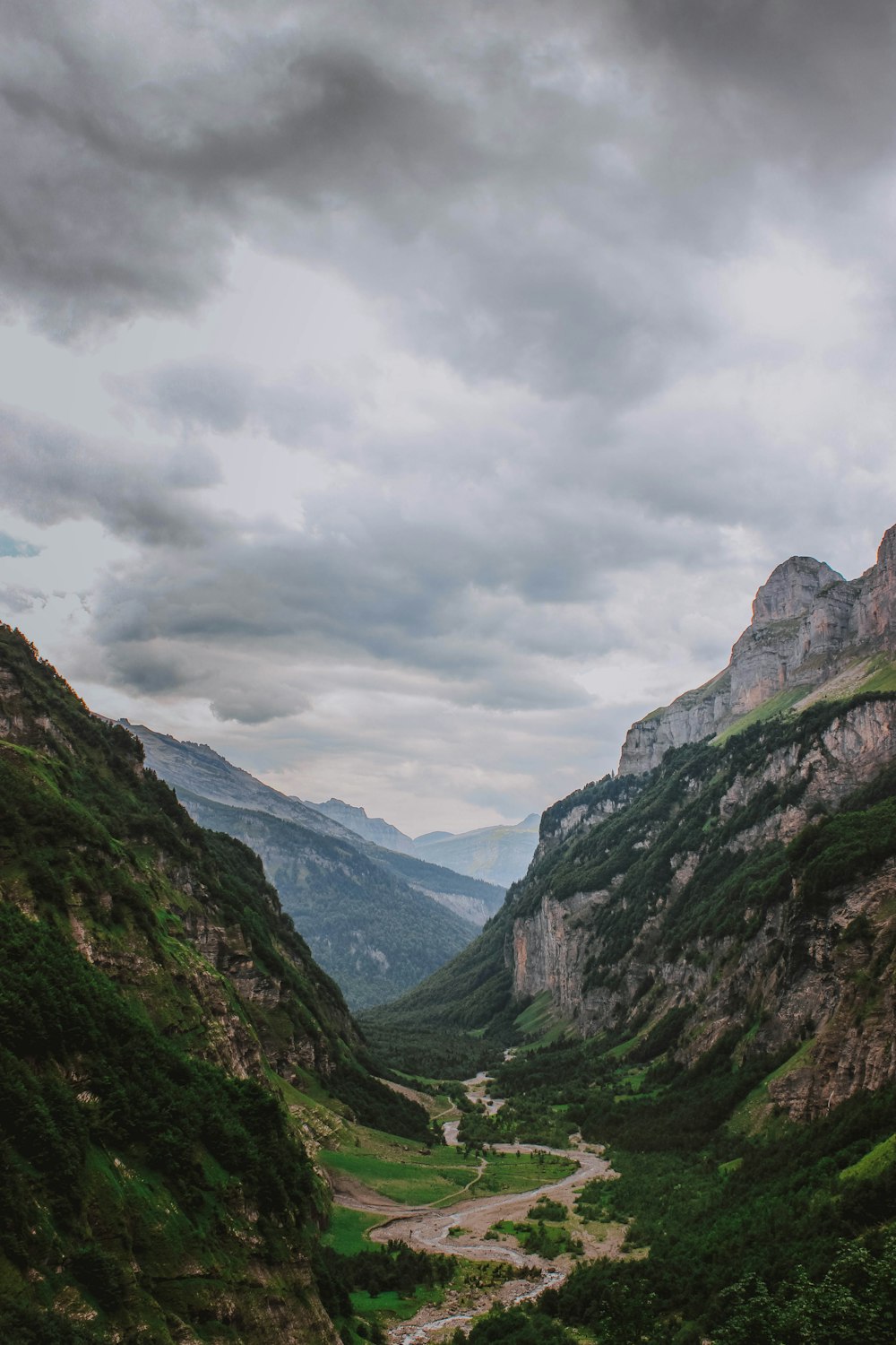 a view of a valley with mountains in the background