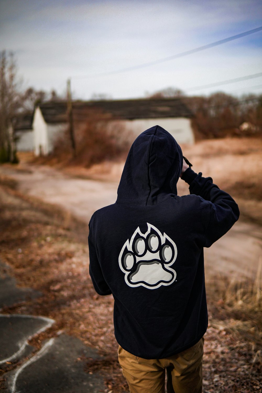 person wearing black and white hoodie