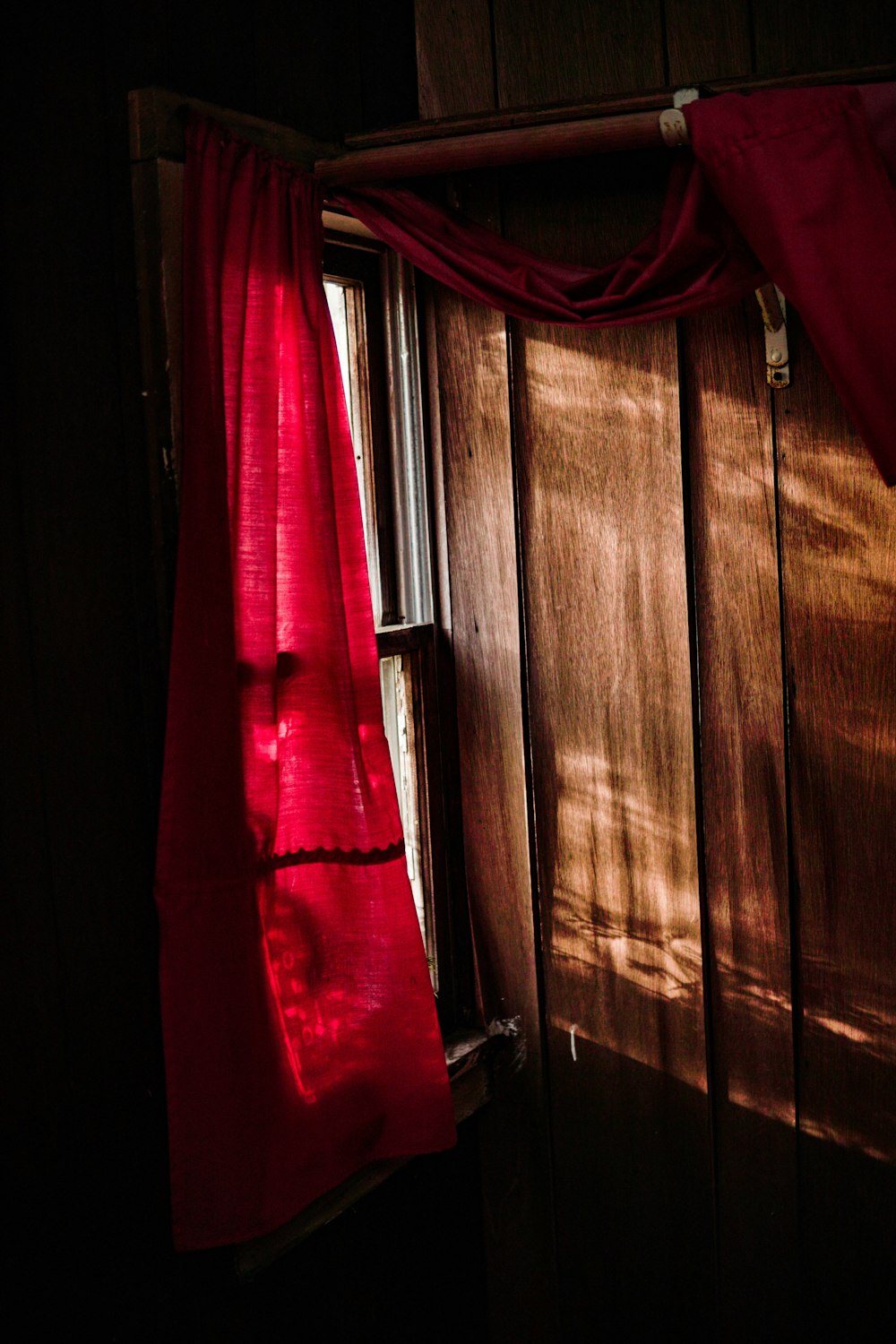 pink window curtain at daytime