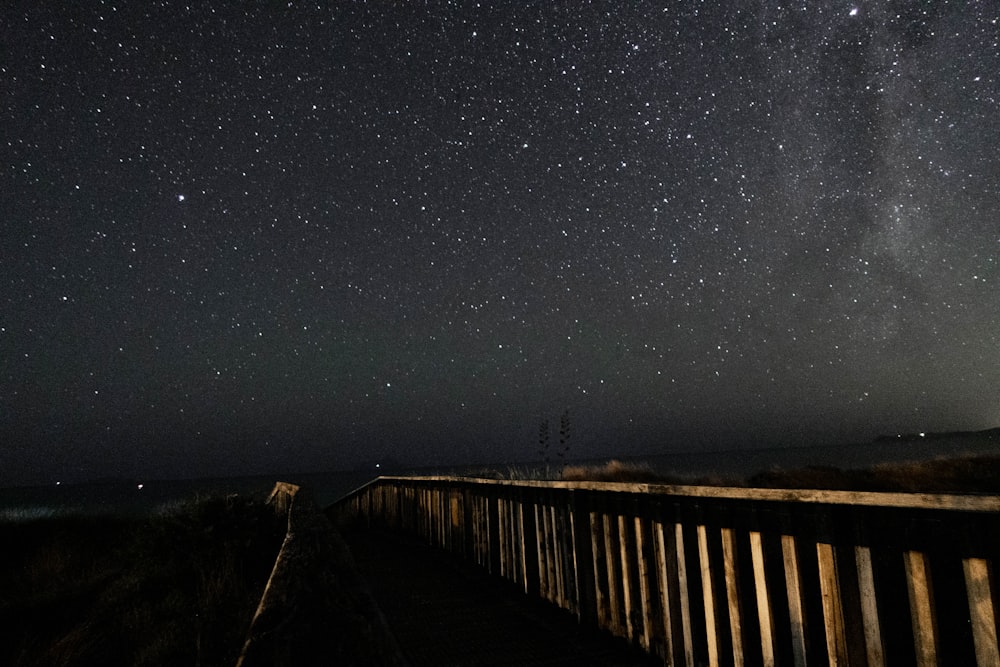 brown wooden fence during nighttime photo