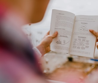 person reading book during daytime