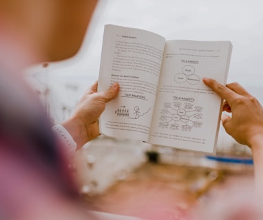 person reading book during daytime