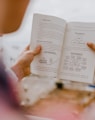 person reading book during daytime