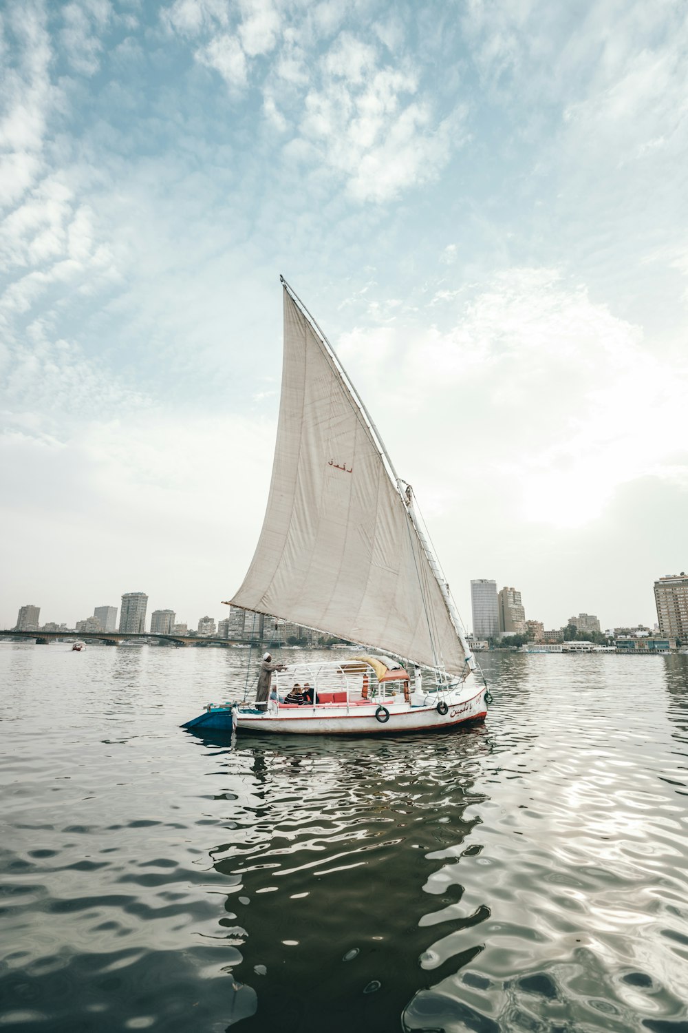 white sailing boat on water