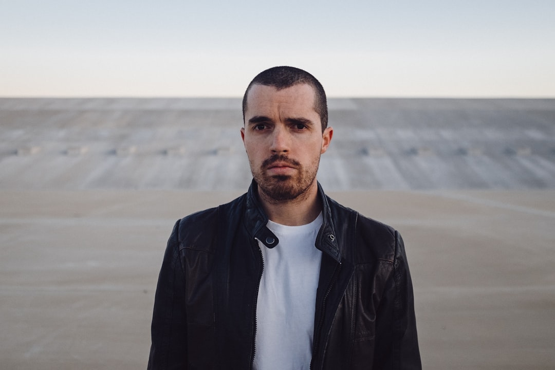 man wearing black leather jacket