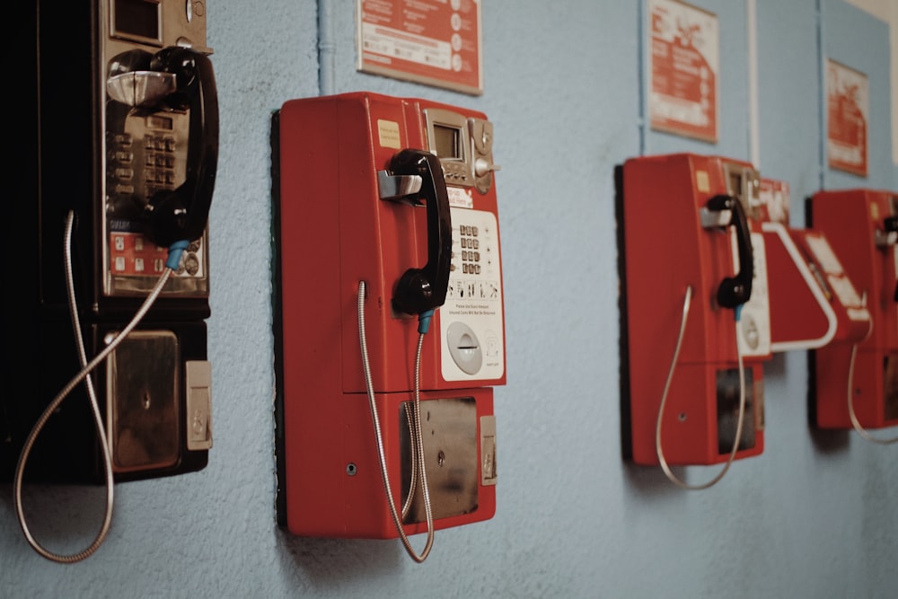 four wall mounted telephones